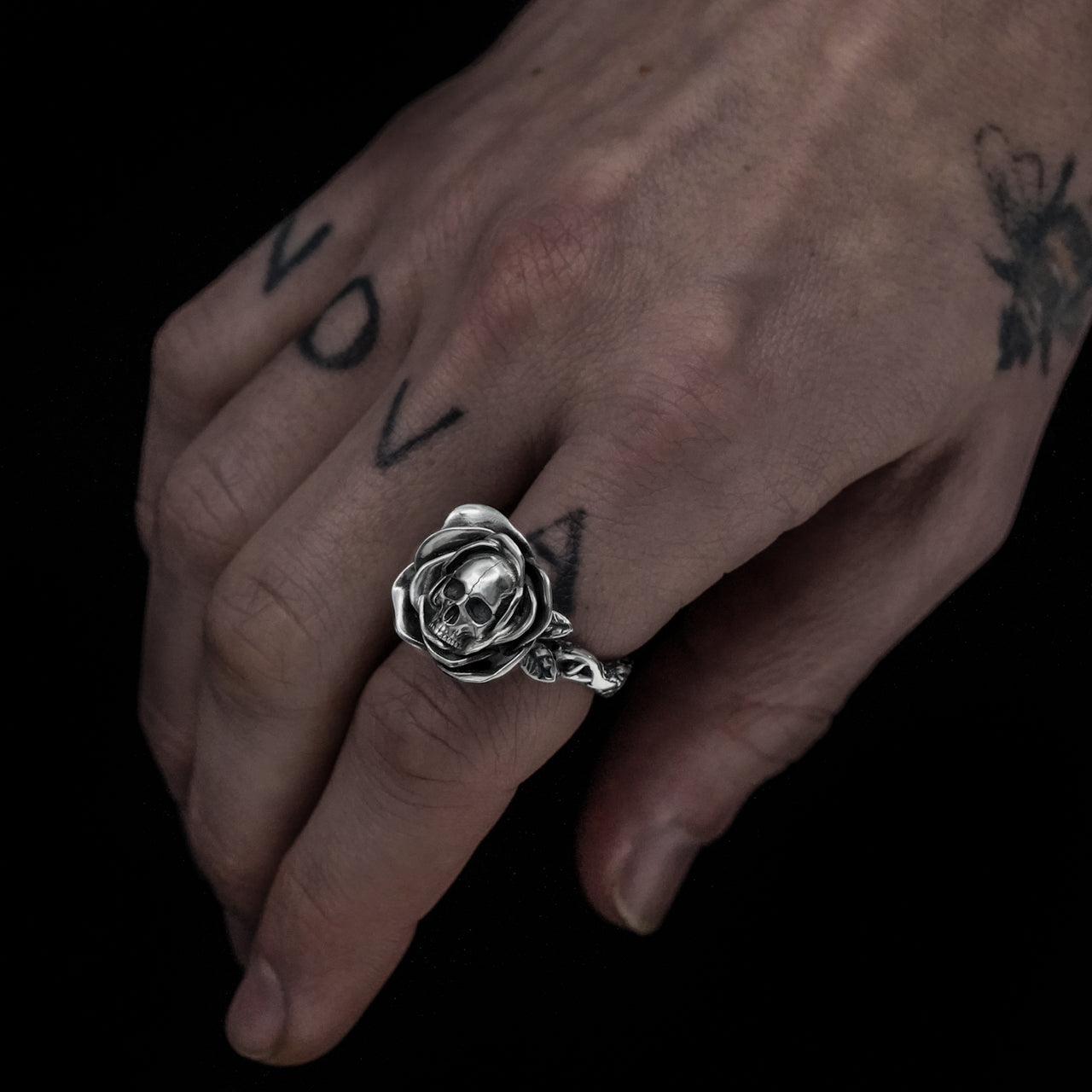 Skull and rose ring in sterling silver on model hand - handmade - Black Feather Design
