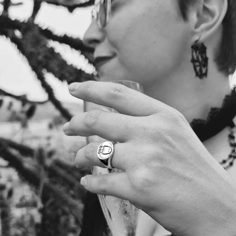 Black and White photo wearing the Sterling Silver Boo Signet Ring