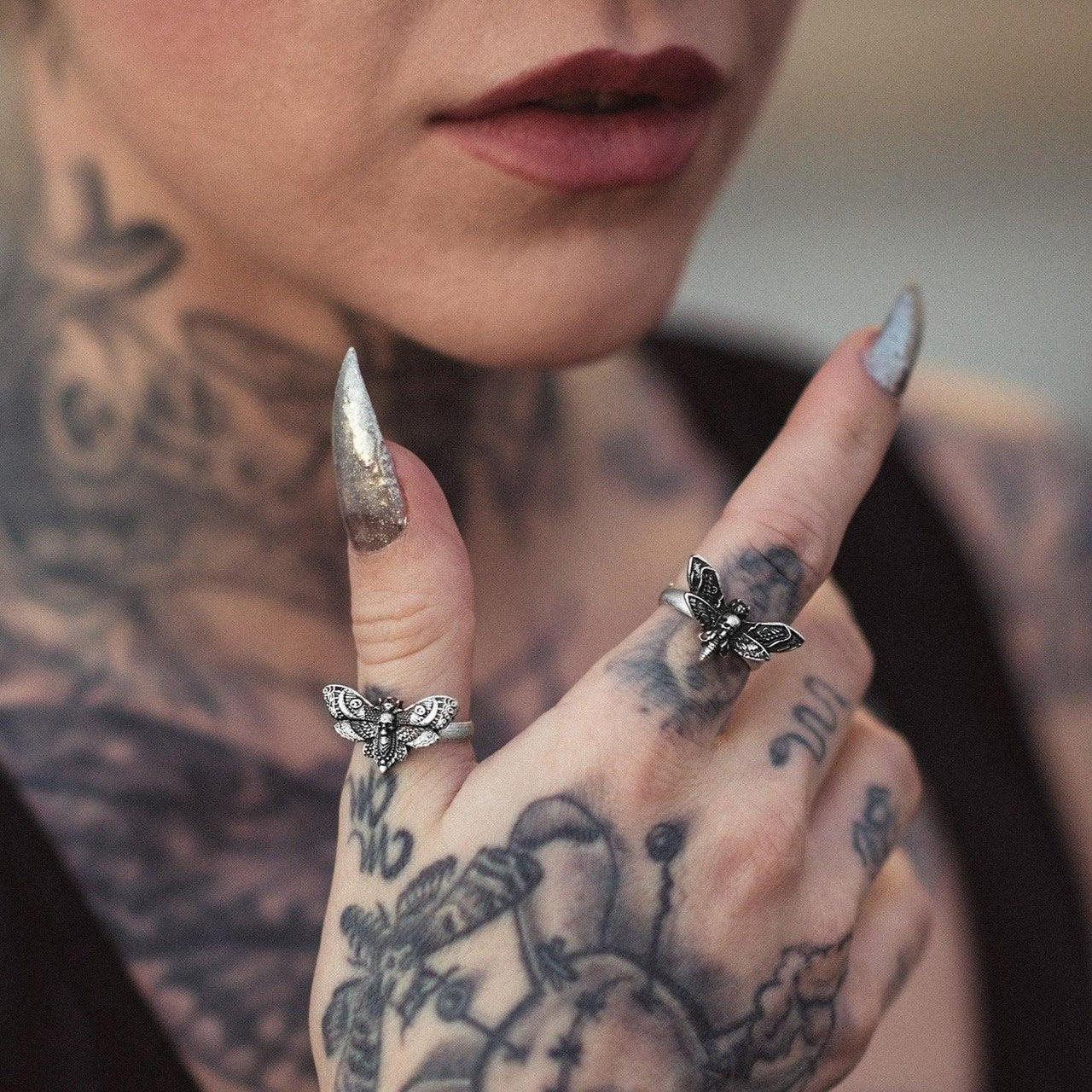 Model Wearing Black Feather Design's Moth Ring Collection