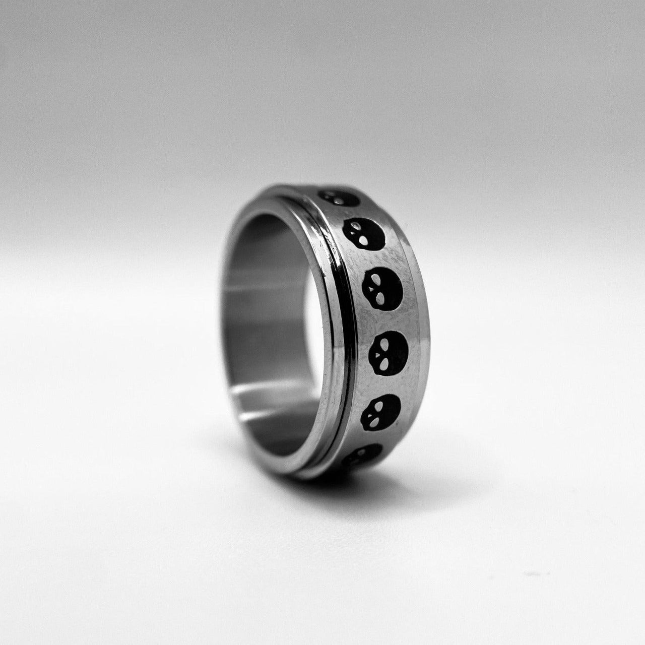 Stainless Steel Spinner Ring with skulls by Black Feather Design
