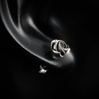 Thumbnail for Model wearing sterling silver rose stud earrings by Black Feather Design