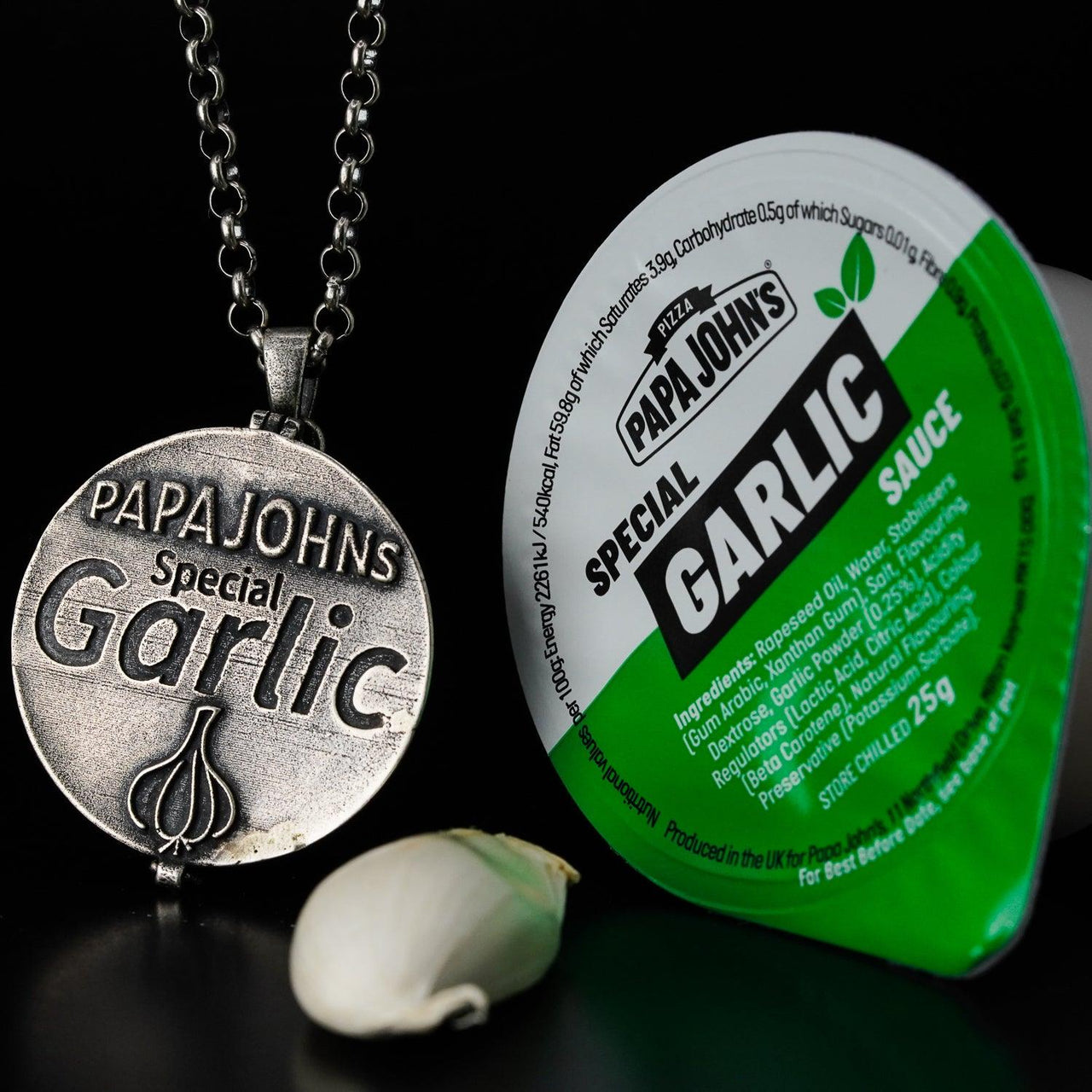 Stranger Bling Pendant next to Papa Johns Special Garlic Sauce made by Black Feather Design