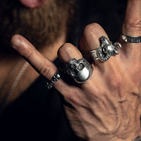 Thumbnail for Model wearing Black Feather Design jewellery - skull rings